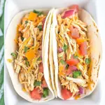 Slow Cooker Queso Chicken Tacos